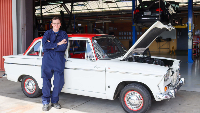 Sam stands in front of his 1966 Singer Vogue at UCOL 